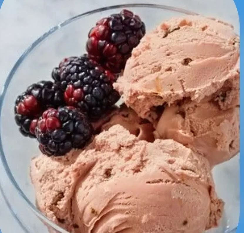 Blackberry ice cream scoops served with fresh blackberries