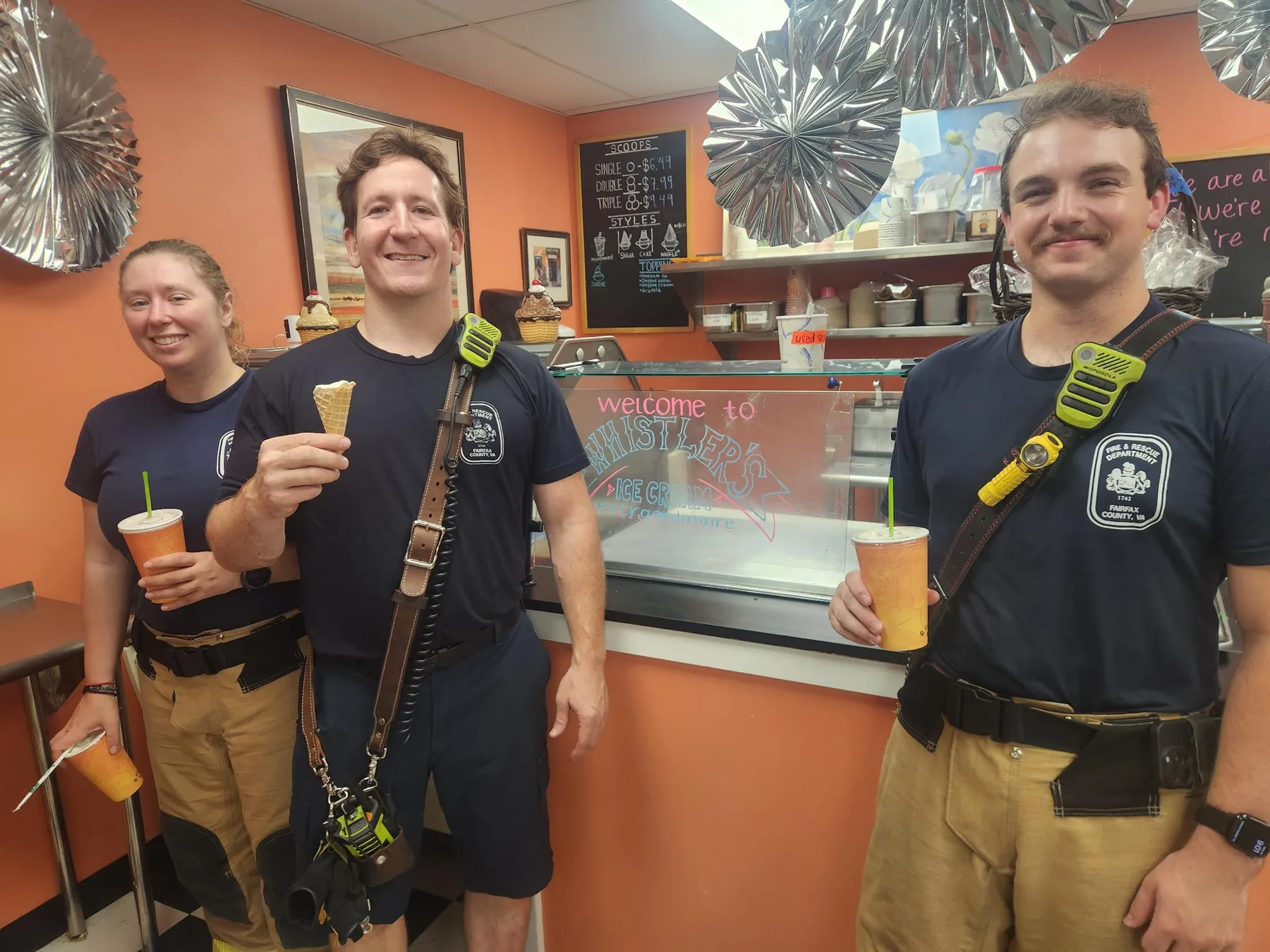Three Fairfax County firefighters enjoying ice cream at Whistler's