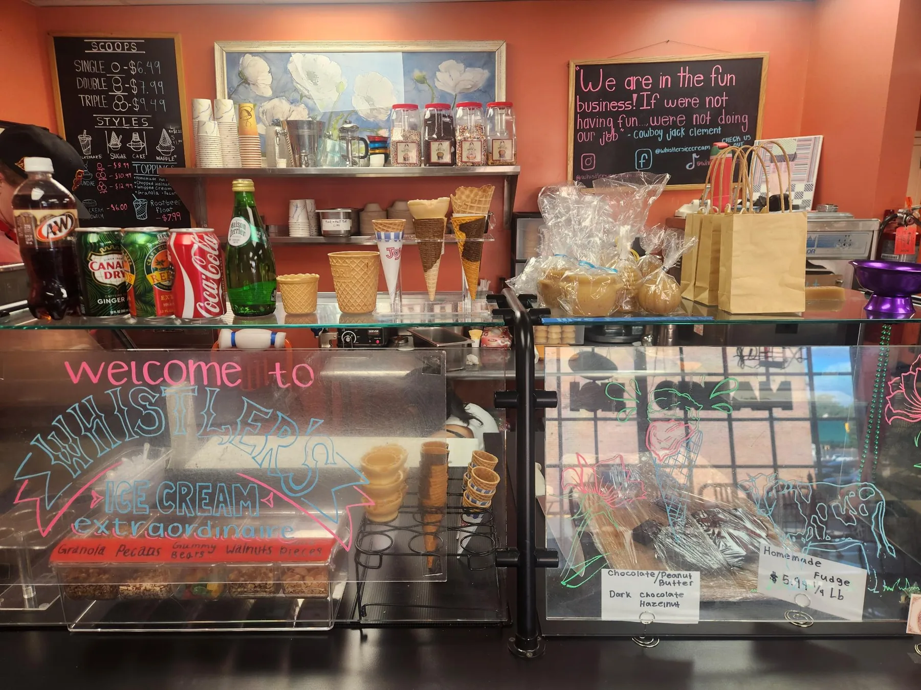 Whistler's counter displaying cones, drinks, toppings, and treats